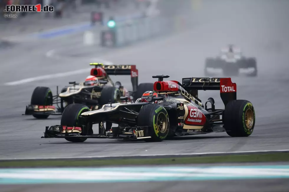 Foto zur News: Kimi Räikkönen (Lotus) und Romain Grosjean (Lotus)