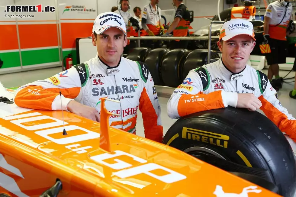 Foto zur News: Adrian Sutil (Force India) und Paul di Resta (Force India) stehen vor dem 100. Grand Prix ihres Teams