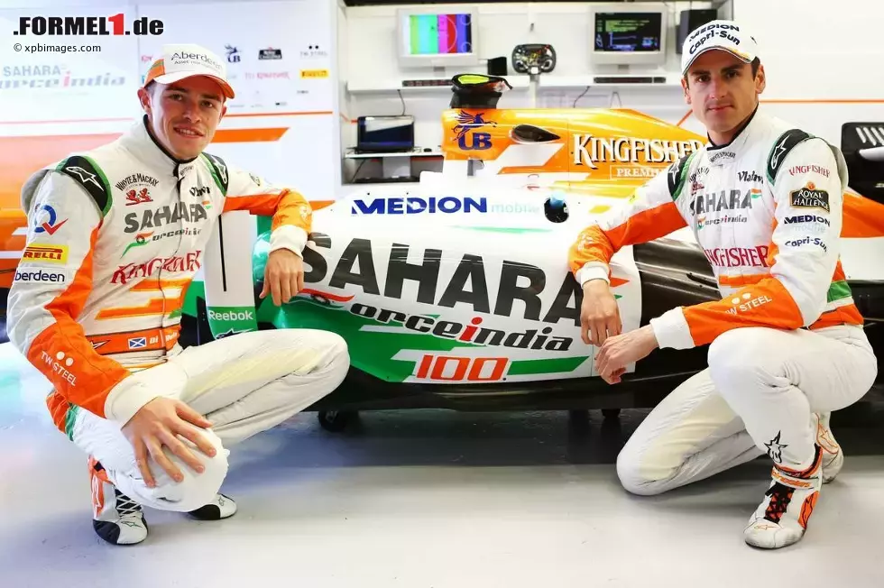 Foto zur News: Adrian Sutil (Force India) und Paul di Resta (Force India) stehen vor dem 100. Grand Prix ihres Teams