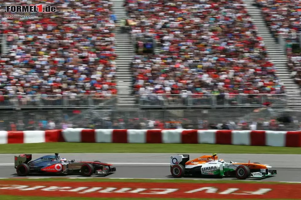 Foto zur News: Adrian Sutil (Force India) und Jenson Button (McLaren)