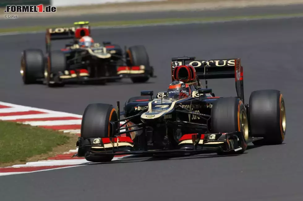 Foto zur News: Kimi Räikkönen (Lotus) und Romain Grosjean (Lotus)