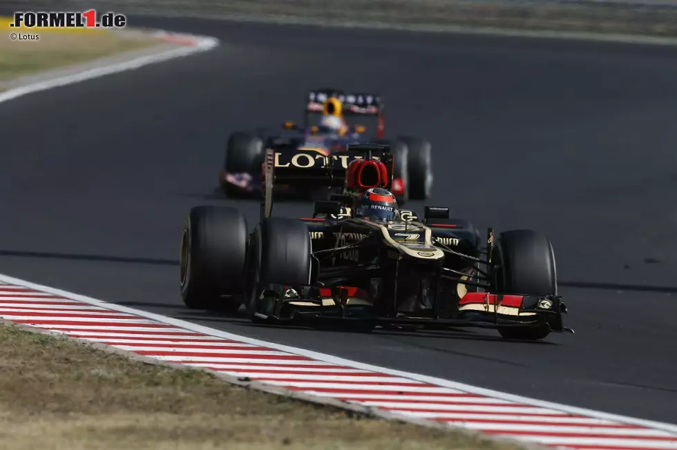 Foto zur News: Kimi Räikkönen (Lotus) und Sebastian Vettel (Red Bull)