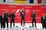 Foto zur News: Sebastian Vettel (Red Bull), Romain Grosjean (Lotus) und Kimi Räikkönen (Lotus)