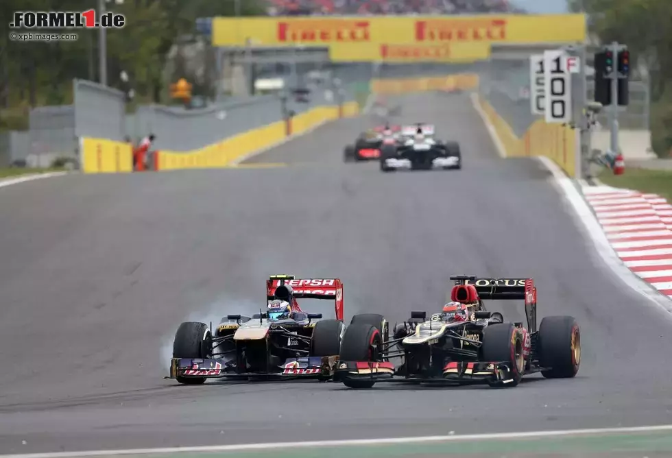 Foto zur News: Daniel Ricciardo (Toro Rosso) und Kimi Räikkönen (Lotus)