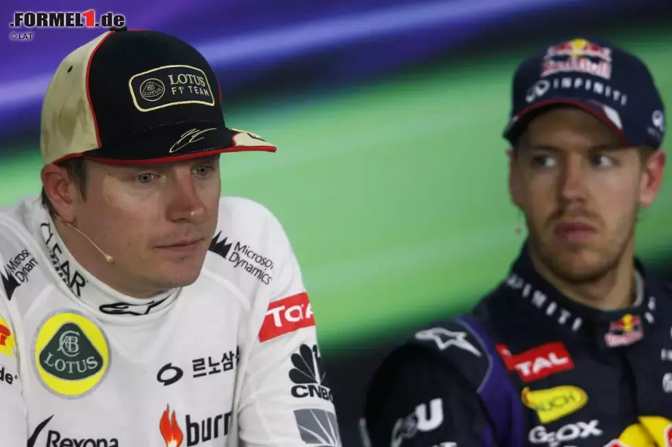 Foto zur News: Kimi Räikkönen (Lotus) und Sebastian Vettel (Red Bull)