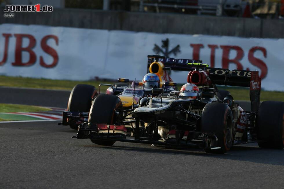 Foto zur News: Romain Grosjean (Lotus) und Sebastian Vettel (Red Bull)