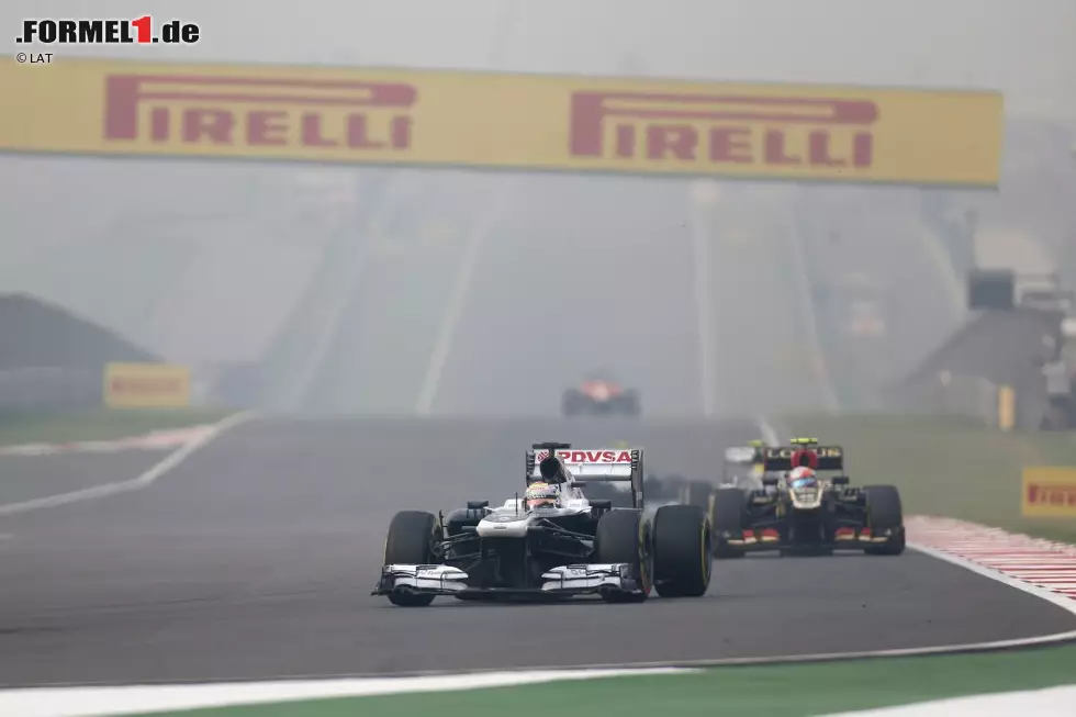 Foto zur News: Pastor Maldonado (Williams) und Romain Grosjean (Lotus)