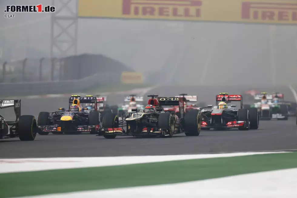 Foto zur News: Kimi Räikkönen (Lotus), Mark Webber (Red Bull) und Sergio Perez (McLaren)