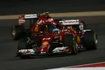 Foto zur News: Fernando Alonso (Ferrari) und Kimi Räikkönen (Ferrari)