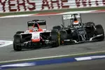 Foto zur News: Jules Bianchi (Marussia) und Adrian Sutil (Sauber)