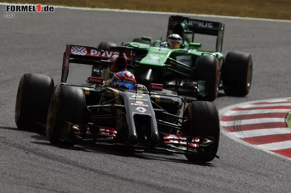 Foto zur News: Romain Grosjean (Lotus) und Kamui Kobayashi (Caterham)