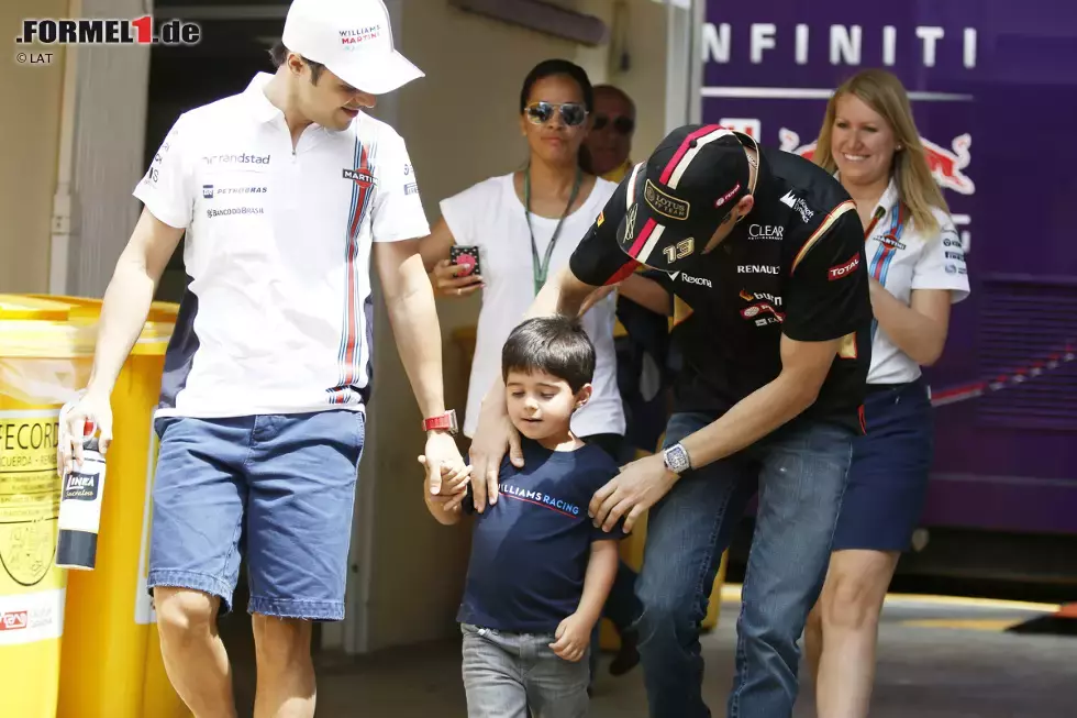 Foto zur News: Pastor Maldonado (Lotus) und Felipe Massa (Williams) mit Sohn