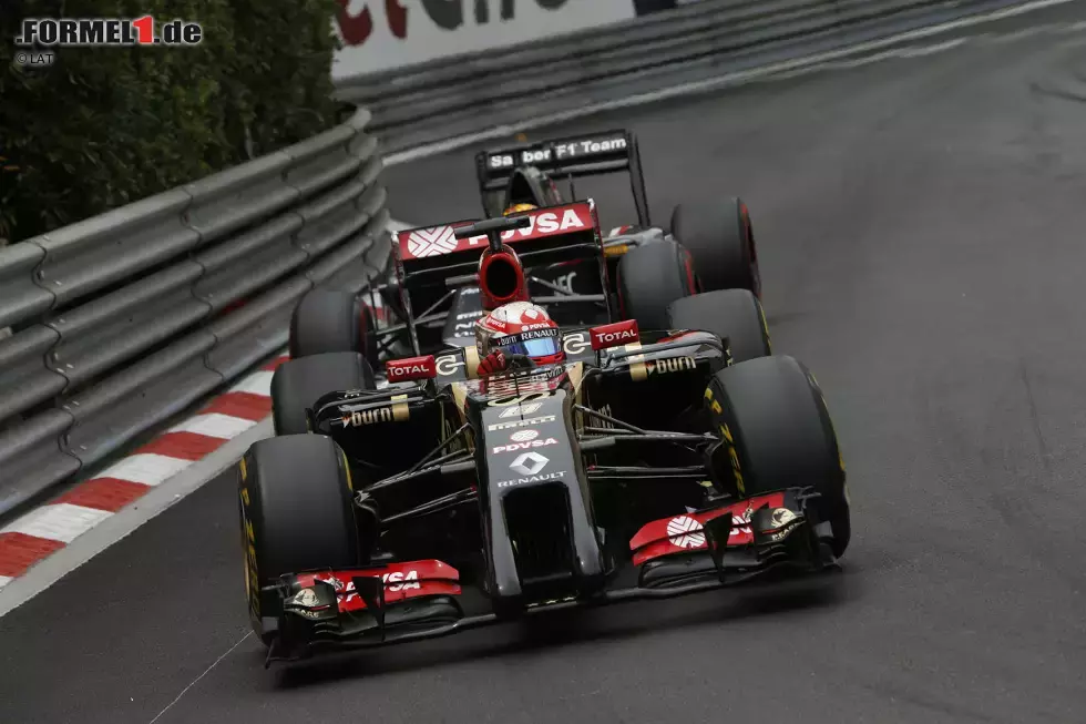 Foto zur News: Romain Grosjean (Lotus) und Adrian Sutil (Sauber)