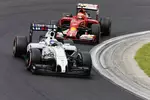 Foto zur News: Felipe Massa (Williams) und Kimi Räikkönen (Ferrari)