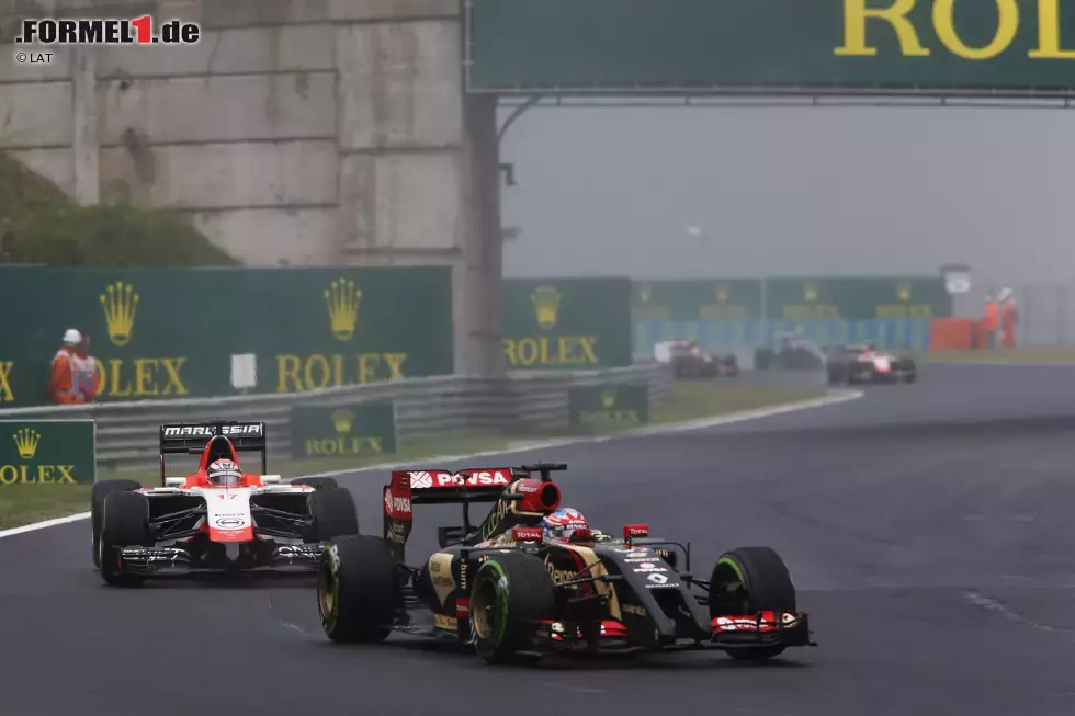 Foto zur News: Romain Grosjean (Lotus) und Jules Bianchi (Marussia)