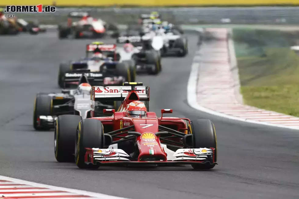 Foto zur News: Kimi Räikkönen (Ferrari) und Adrian Sutil (Sauber)