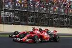 Foto zur News: Fernando Alonso (Ferrari) und Kimi Räikkönen (Ferrari)