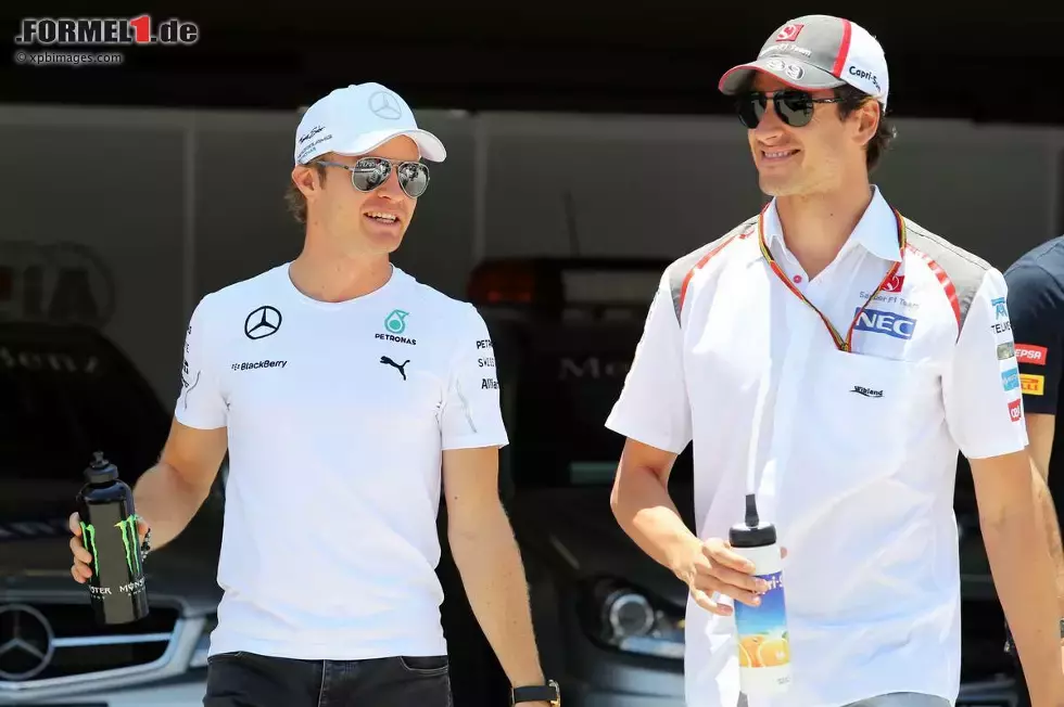 Foto zur News: Nico Rosberg (Mercedes) und Adrian Sutil (Sauber)