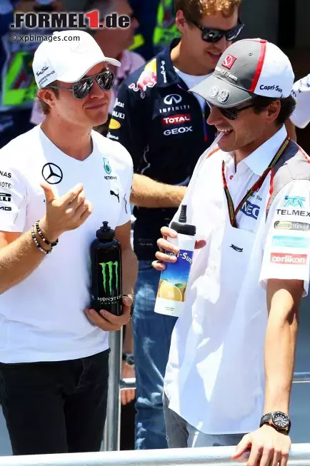 Foto zur News: Nico Rosberg (Mercedes) und Adrian Sutil (Sauber)