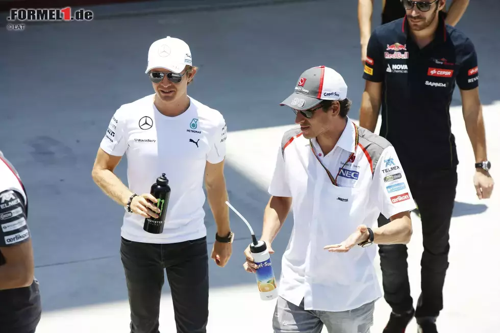 Foto zur News: Nico Rosberg (Mercedes) und Adrian Sutil (Sauber)