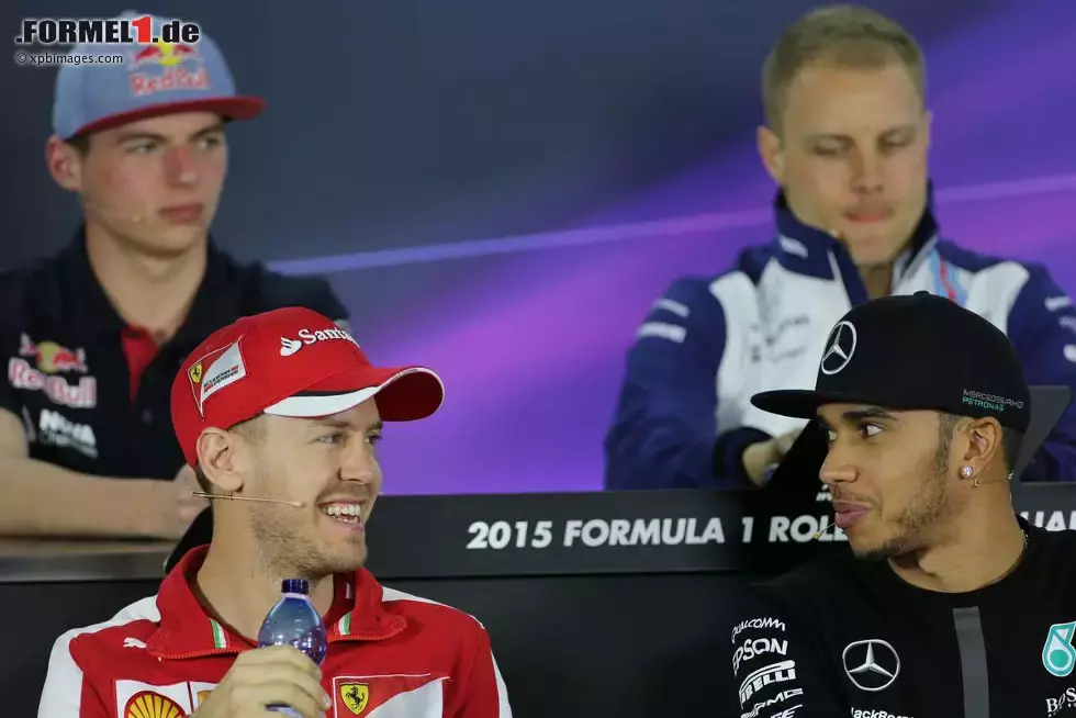 Foto zur News: Sebastian Vettel (Ferrari) und Lewis Hamilton (Mercedes)