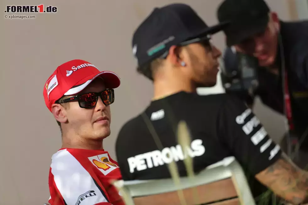 Foto zur News: Sebastian Vettel (Ferrari) und Lewis Hamilton (Mercedes)