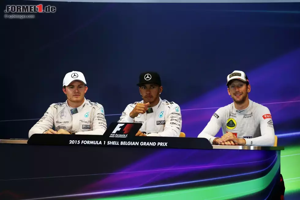 Foto zur News: Nico Rosberg (Mercedes), Lewis Hamilton (Mercedes) und Romain Grosjean (Lotus)