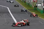 Foto zur News: Sebastian Vettel (Ferrari), Kimi Räikkönen (Ferrari) und Nico Rosberg (Mercedes)