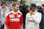 Foto zur News: Sebastian Vettel (Ferrari) und Lewis Hamilton (Mercedes)