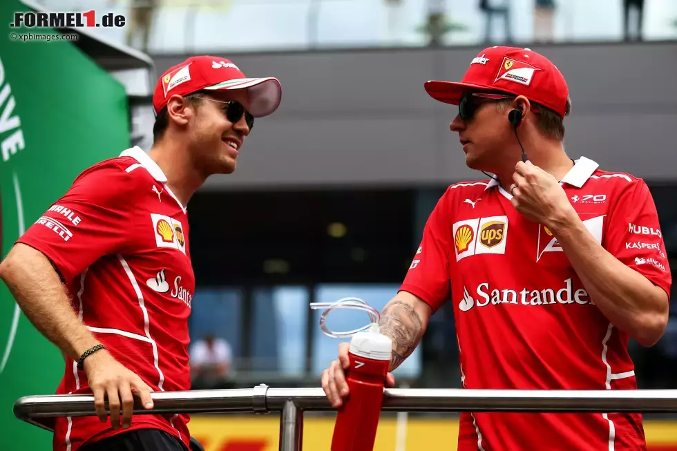 Foto zur News: Sebastian Vettel (Ferrari) und Kimi Räikkönen (Ferrari)