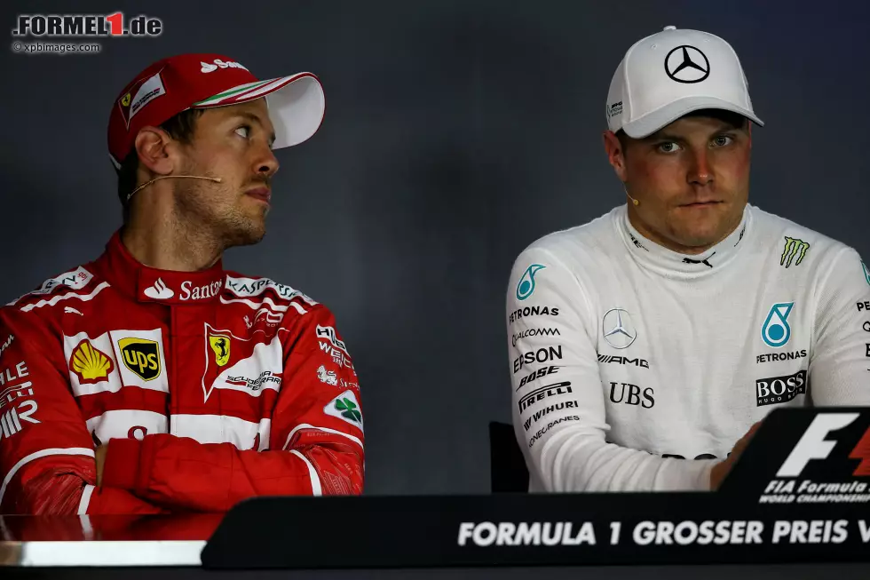 Foto zur News: Sebastian Vettel (Ferrari) und Valtteri Bottas (Mercedes)