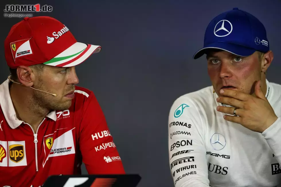 Foto zur News: Sebastian Vettel (Ferrari) und Valtteri Bottas (Mercedes)