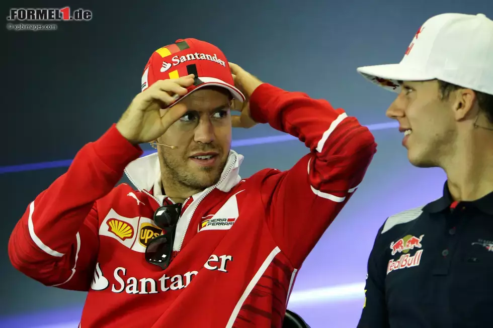 Foto zur News: Sebastian Vettel (Ferrari) und Pierre Gasly (Toro Rosso)