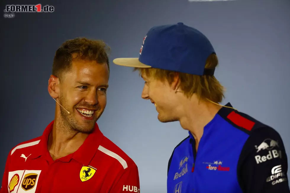 Foto zur News: Sebastian Vettel (Ferrari) und Brendon Hartley (Toro Rosso)