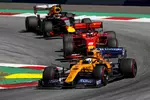 Foto zur News: Lando Norris (McLaren), Sebastian Vettel (Ferrari) und Max Verstappen (Red Bull)