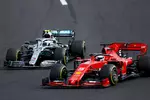 Foto zur News: Sebastian Vettel (Ferrari) und Valtteri Bottas (Mercedes)