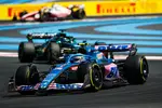 Foto zur News: Esteban Ocon (Alpine) und Lance Stroll (Aston Martin)