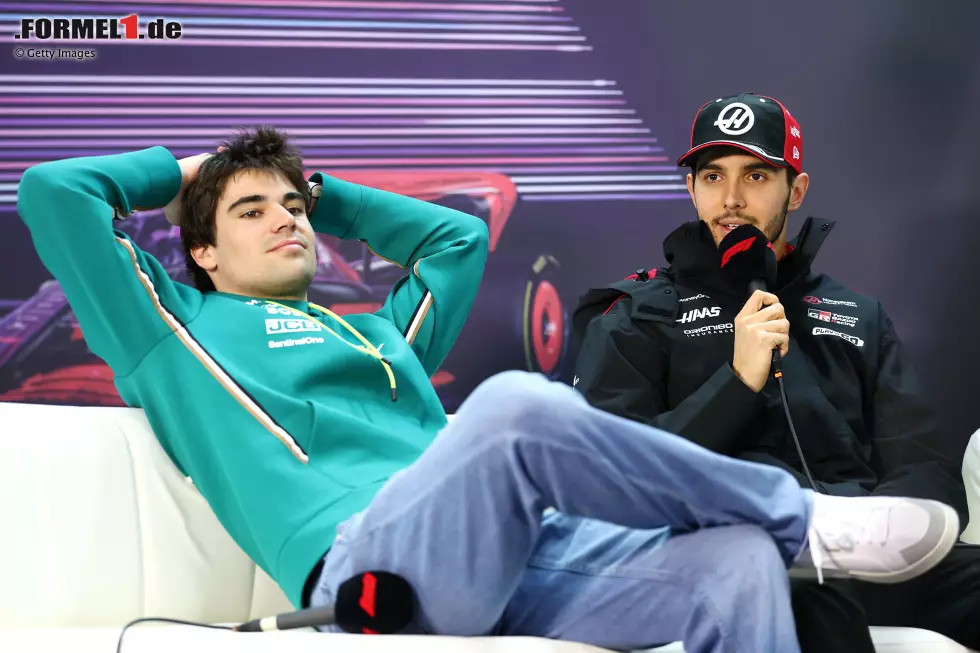 Foto zur News: Lance Stroll (Aston Martin) und Esteban Ocon (Haas)