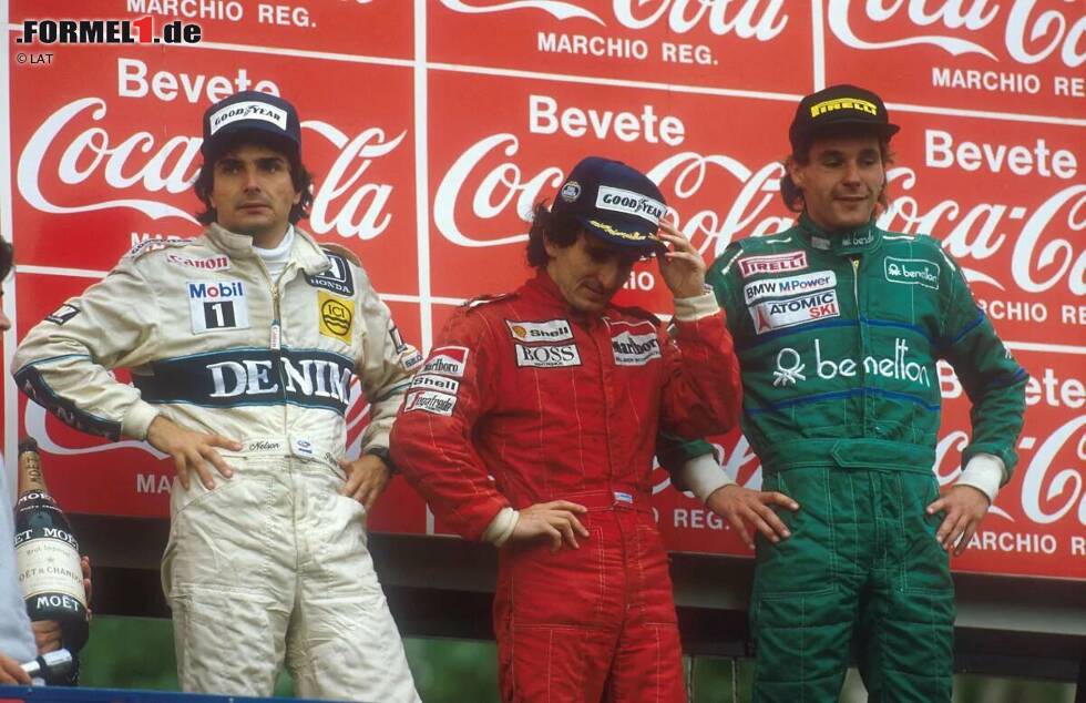 Foto zur News: Imola 1986: Bergers drittes Rennen für Benetton bringt den ersten Podestplatz. Hinter Alain Prost (McLaren) und Nelson Piquet (Williams) bringt er seinen B186 als Dritter ins Ziel. Kurz vor Schluss lässt er sich bewusst von Prost überrunden, um eine Runde weniger fahren zu müssen. Zahlreiche andere rollen ohne Sprit aus.