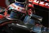 Foto zur News: Regen am Donnerstag: Button vor Grosjean