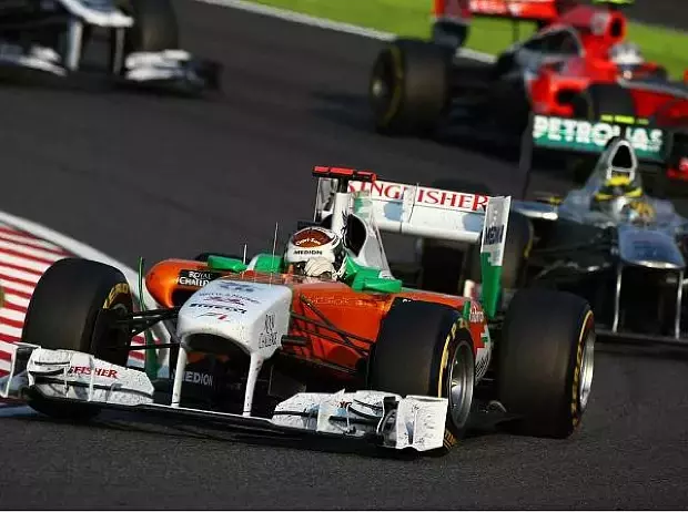 Foto zur News: Suzuka: Button besiegt den neuen Weltmeister!